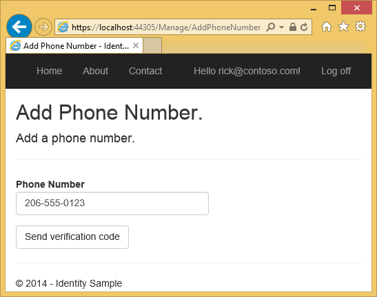 显示 ASP .NET 应用的“添加电话号码”页的屏幕截图。示例电话号码下方填写了“发送验证码”按钮。